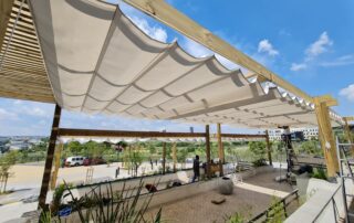 Slideshade ® Pergola Awning In Resturant - Beige with wooden beems - Complete view