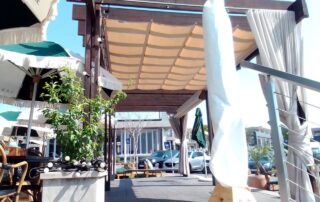 Slideshade ® Pergola Awning In Resturant - Beige with wooden beems